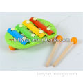 Children play small wooden musical toys